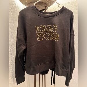 This is  sweatsuit outfit, it’s black and gold, Top and Pants.